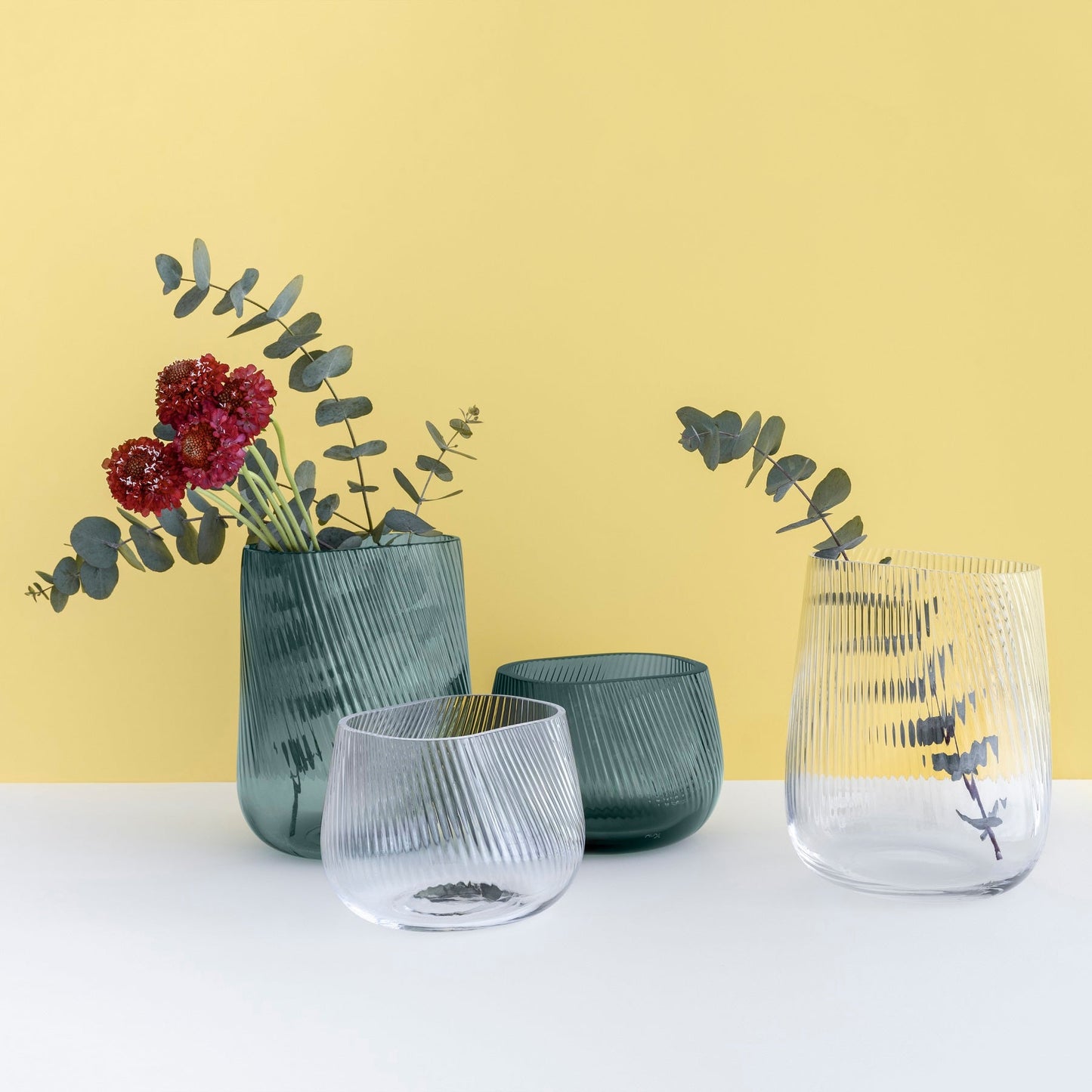 Group of NUDE OPti vases by Defne Koz in clear and smoked green